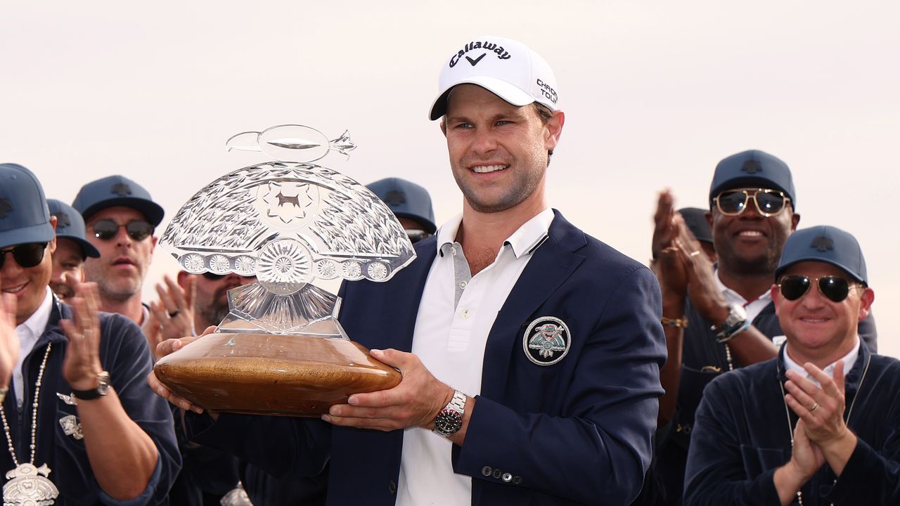 Thomas Detry poses with the WM Phoenix Open trophy after winning in 2025