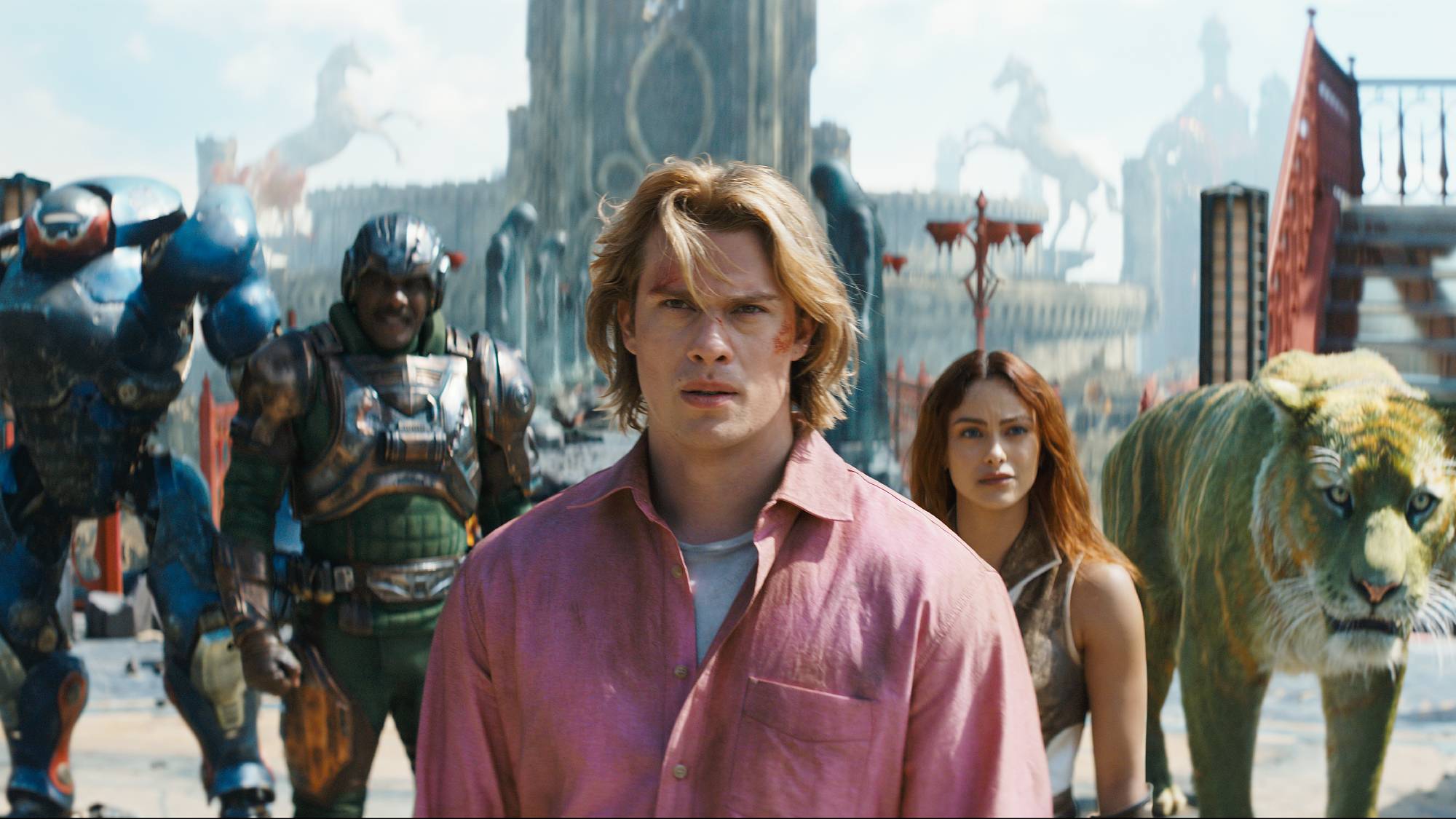 Roboto (Kristen Wiig), Man At Arms (Idris Elba), Adam (Nicholas Galitzine), Teela (Camila Mendes) and Cringer in "Masters of the Universe" film (2026)