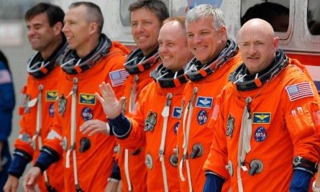 The Endeavor&amp;#039;s astronauts, including Gabrielle Giffords&amp;#039; husband Commander Mark Kelly (right), were all suited up but the launch was postponed for technical reasons.