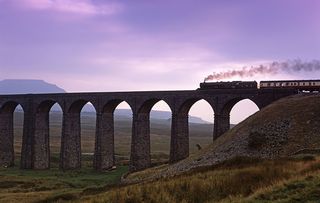 A steam train crosses the Ribblehead Viaduct in North Yorkshire.