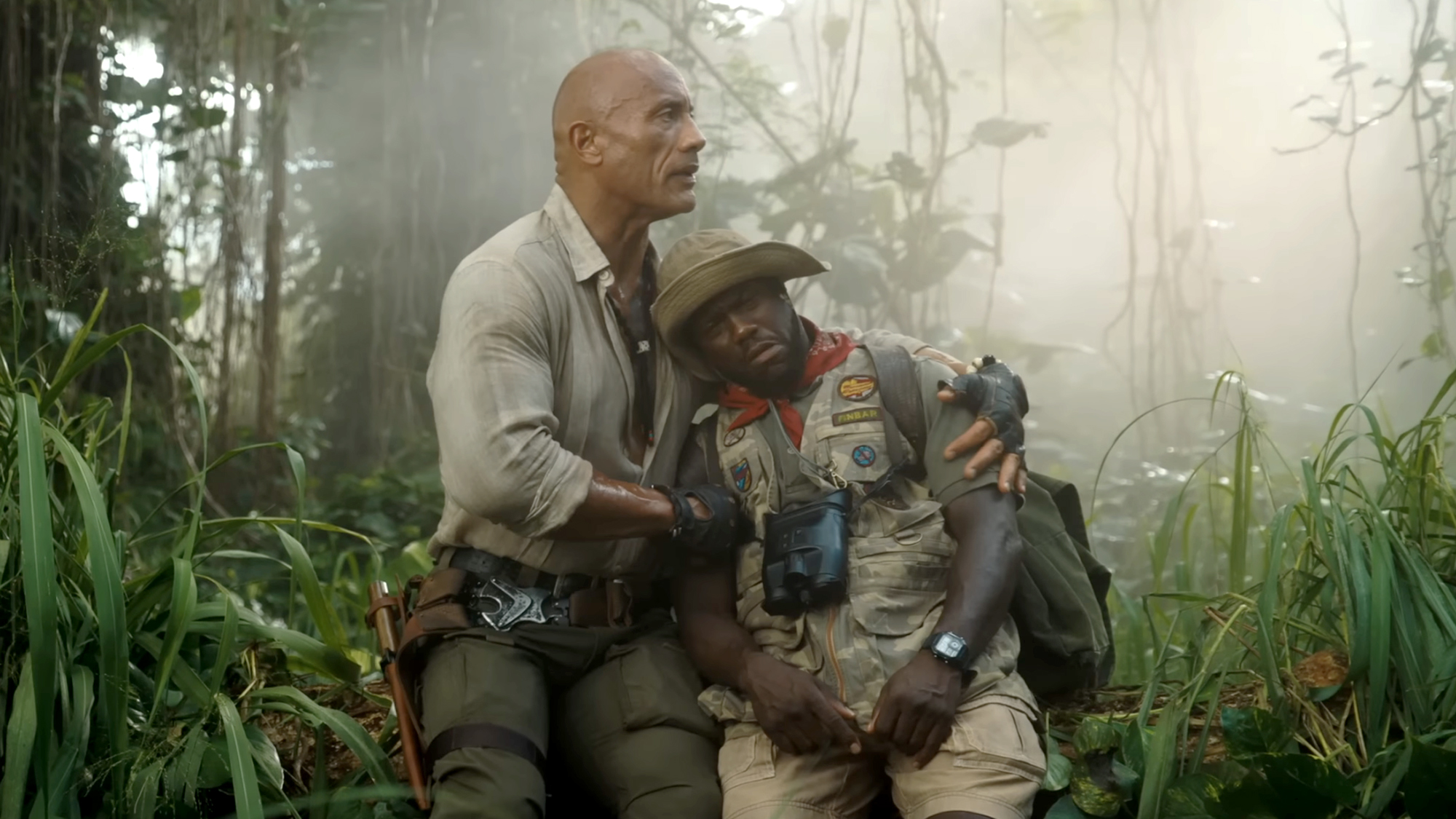 The Rock holds Kevin Hart in Jumanji: Open World (2026).