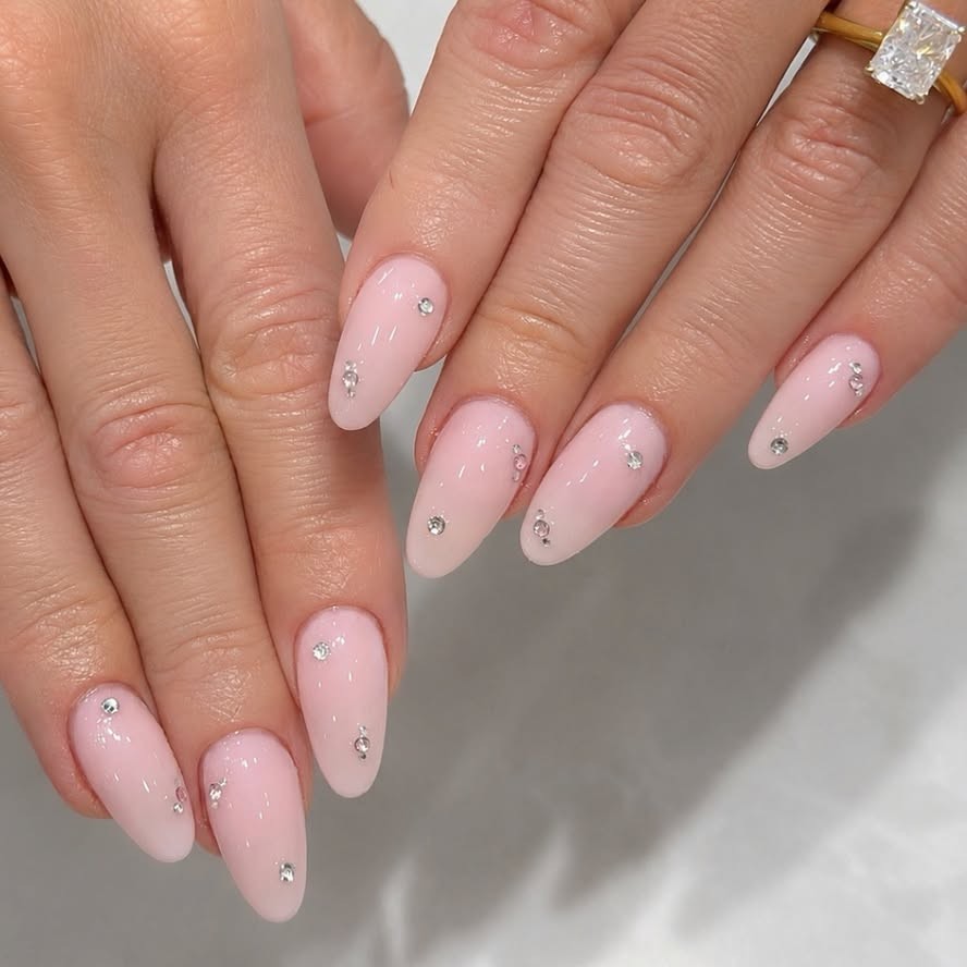 A manicure with scattered gems.