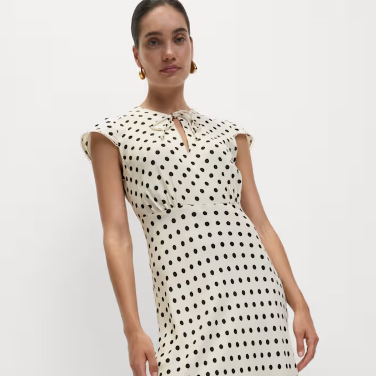 Woman wears polka dot dress