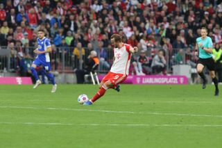 Harry Kane shoots to score from inside his own half for Bayern Munich against Darmstadt, 2023