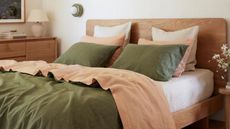 Best linen sheets: Green and pink bed thread sheets on bed 