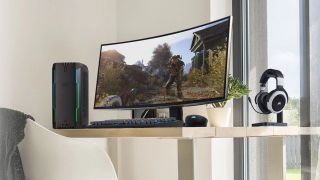 Corsair One i164 next to a curved screen