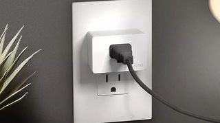 Wemo Smart Plug with Thread installed in an outlet.