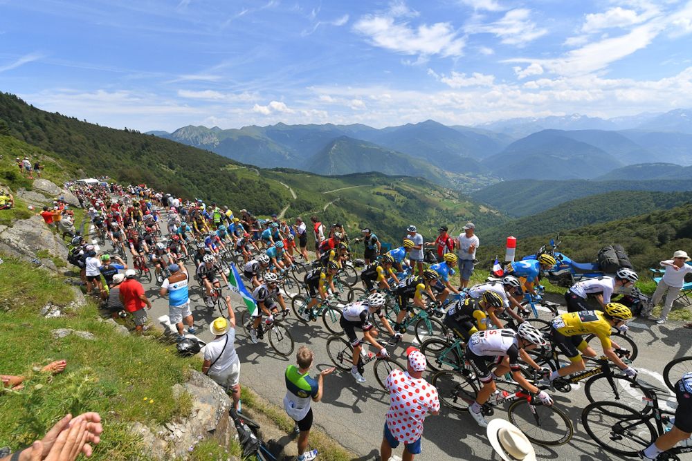 The peloton climbs during stage 19