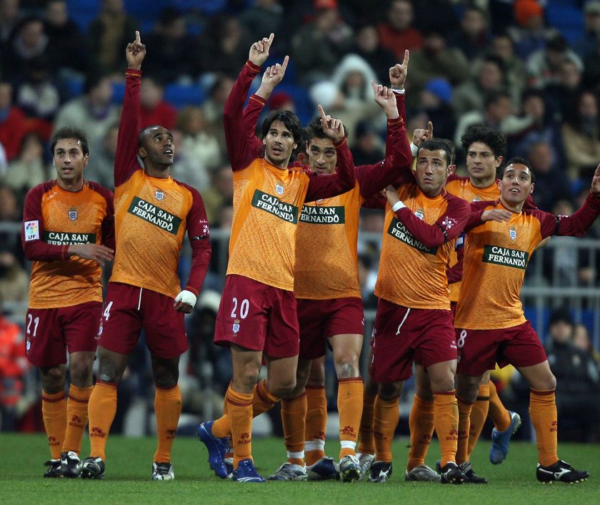 Madrid, SPAIN: Recreativo de Huelva&amp;apos; players celebrate after scoring their first goal Real Madrid during their Spanish league football match at Santiago Bernabeu stadium in Madrid, 20 December 2006. AFP PHOTO JAVIER SORIANO. (Photo credit should read JAVIER SORIANO/AFP via Getty Images)