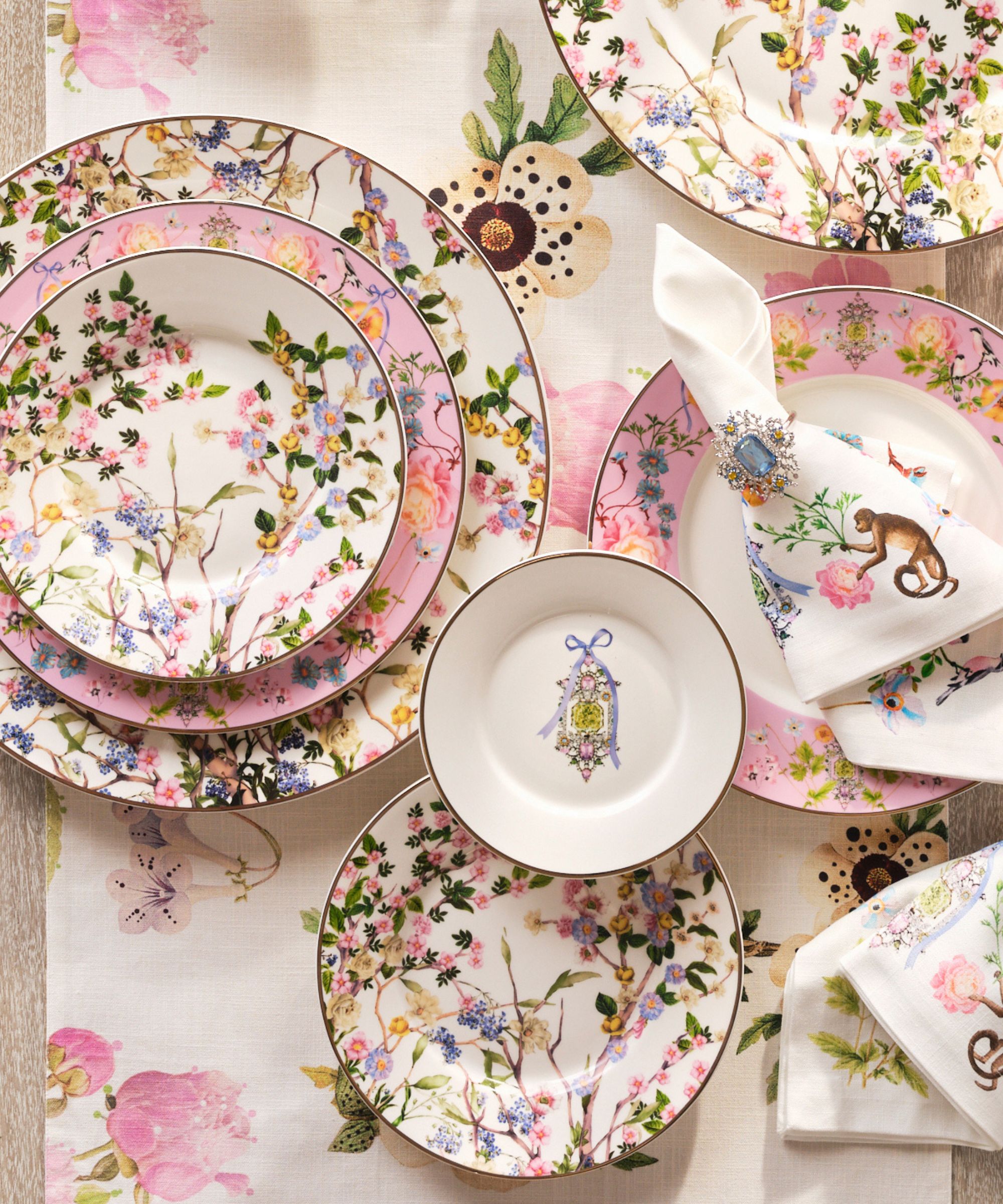 floral pink themed tableware with napkins and table runner