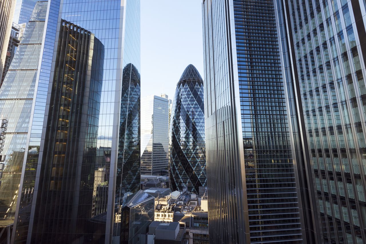 UK, London, elevated view of modern high rise office buildings in the city at sunset.