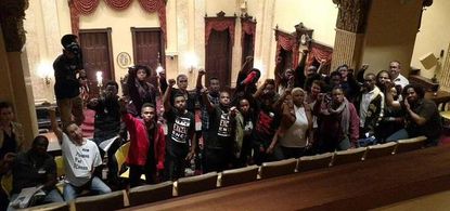 Members of the Baltimore Uprising organization inside Baltimore City Hall.