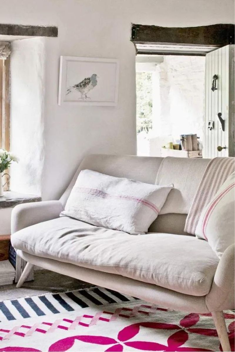 country living room with sofa and open door