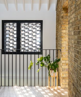 inside of extension with light shining through brick covering over window