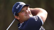 Patrick Reed takes a tee shot at the 2023 Dubai Desert Classic