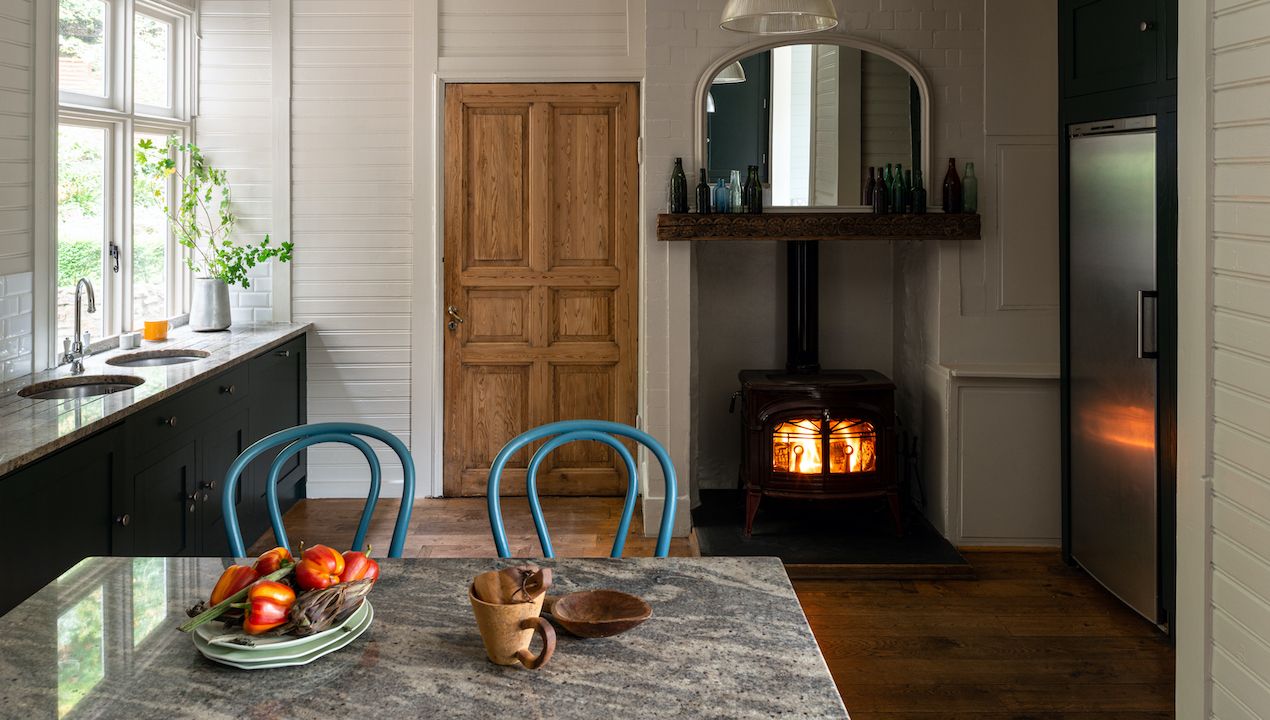 kitchen with lit woodburner