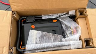 Worx WG743 POWER SHARE 40-Volt 17 in. Cordless Mower being tested in writer's home