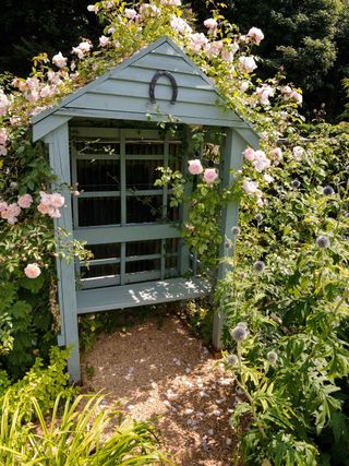 blue arbor with roses