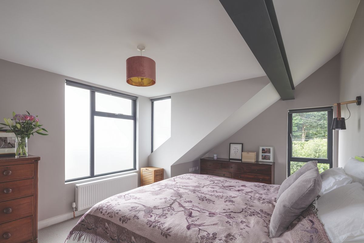 The house redesign has created four new bedrooms including the master (above) and an en suite in the dormer space.