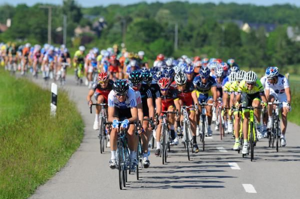 Finnish road champion Kjell Carlstrom (Sky) heads the peloton.