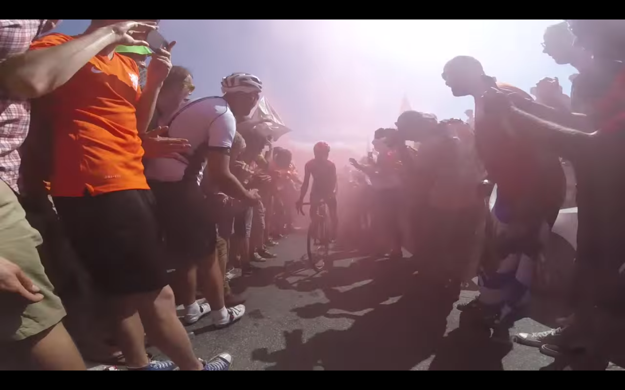 Riding through Dutch corner on the climb to l'alpe d'Huez at the Tour de France