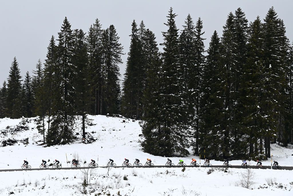 BRUNICO ITALY APRIL 21 A general view of the peloton climbing to the snowy and mountainous pass of the Passo Lavaz 1808m during the 46th Tour of the Alps 2023 Stage 5 a 1445km stage from Cavalese to Brunico on April 21 2023 in Brunico Italy Photo by Tim de WaeleGetty Images