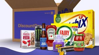 A selection of groceries arranged in front of a Discount Dragon branded cardboard box