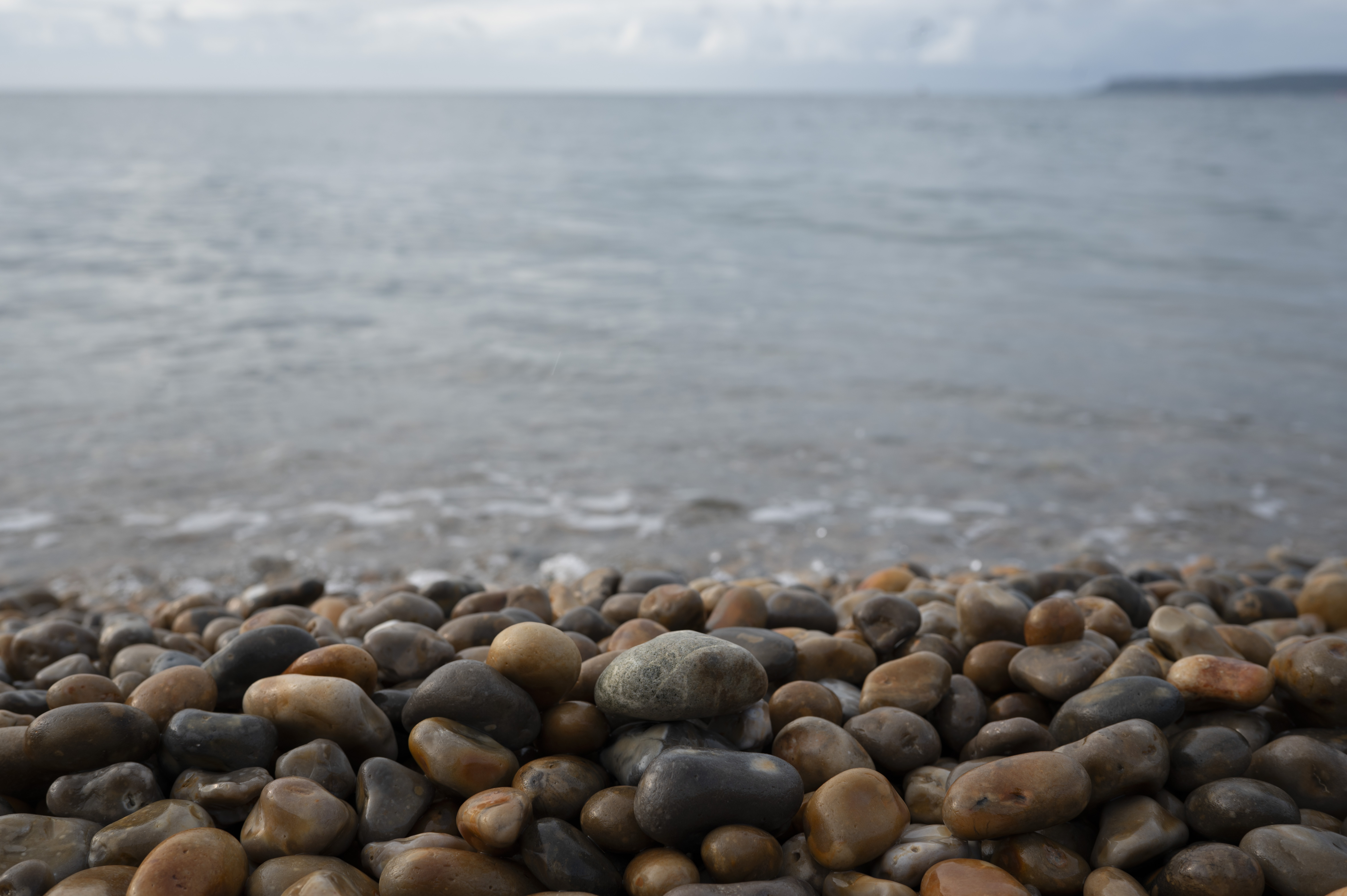 Pebbles on a beach, taken with the Nikon Z 35mm f/1.4 lens