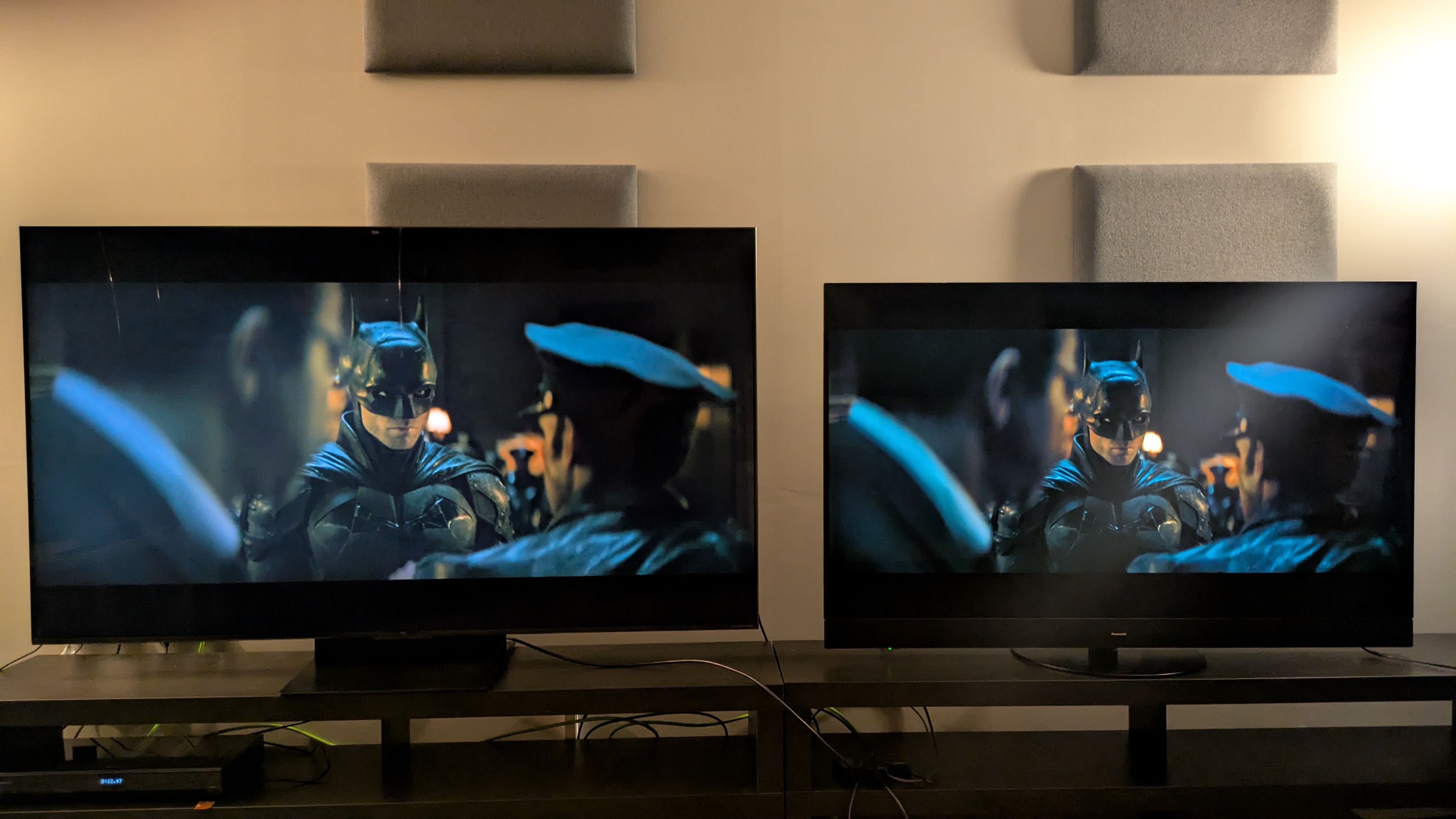 TCL C7K left and Panasonic MZ1500 right showing The Batman on screen