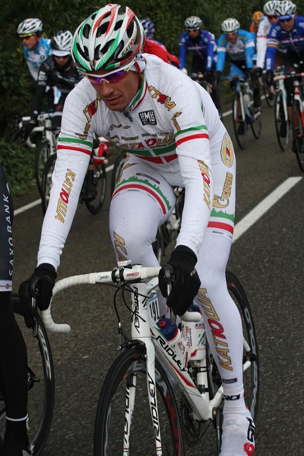 Filippo Pozzato (Katusha) possibly regretting his all-white kit on the filthy day.