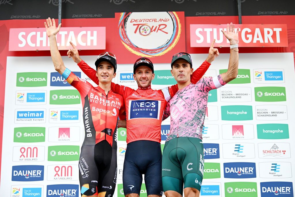 STUTTGART GERMANY AUGUST 28 LR Pello Bilbao Lpez of Spain and Team Bahrain Victorious on second place race winner Adam Yates of United Kingdom and Team INEOS Grenadiers Red Leader Jersey and Ruben Guerreiro of Portugal and Team EF Education Easypost on third place pose on the podium ceremony after the 37th Deutschland Tour 2022 Stage 4 a 1866km stage from Schiltach to Stuttgart DeineTour on August 28 2022 in Stuttgart Germany Photo by Stuart FranklinGetty Images