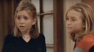 Mary-Kate and Ashley Olsen standing next to each other on Two of a Kind