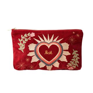personalised gifts red velvet pouch with heart and floral embroidery customised with the name beth 