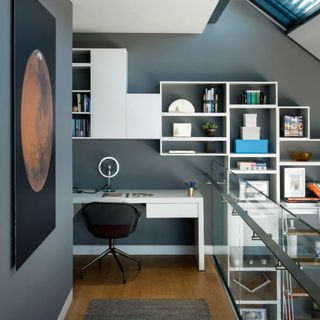 study room with grey wall and white table