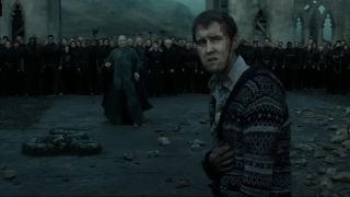 Neville with Voldemort in the background.