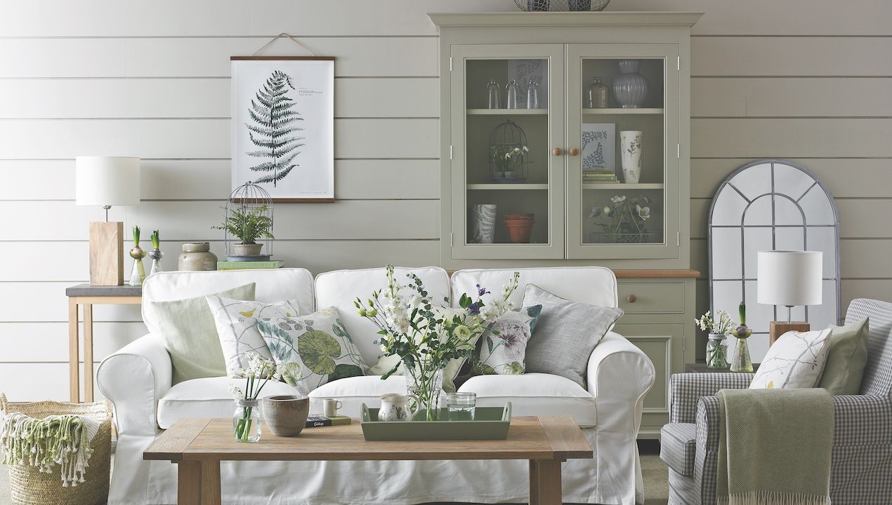 display cabinet in neutral room with white sofa