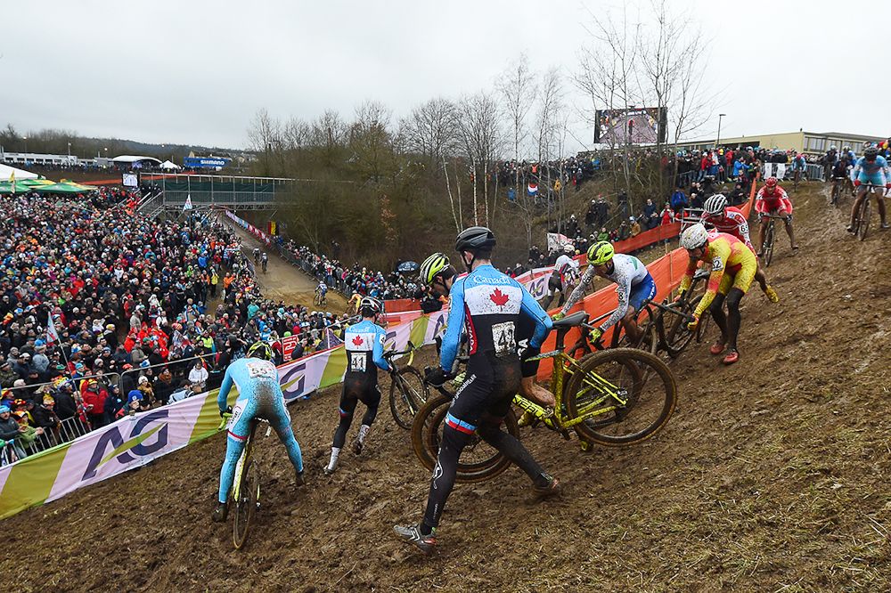 Riders negotiate the slick downhill section