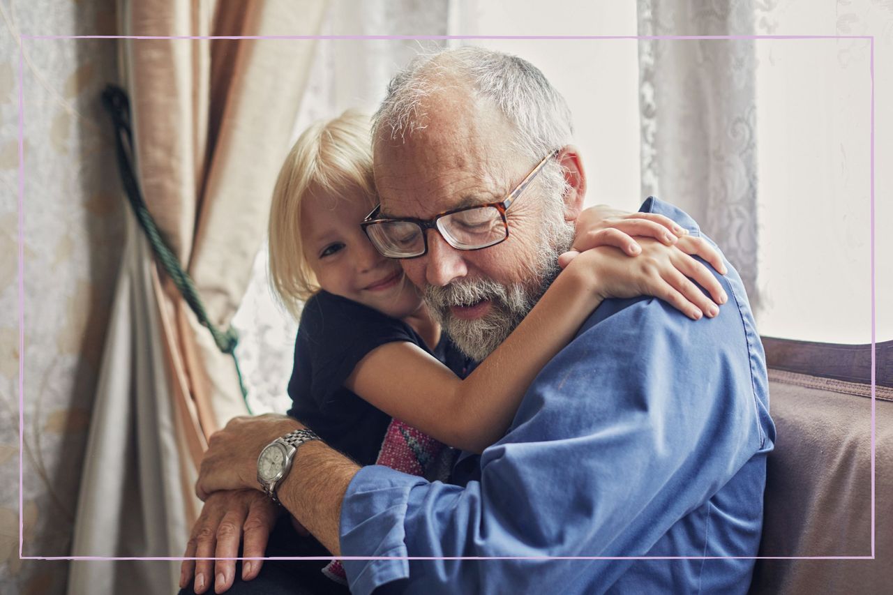 Grandfather hugging his grandchild