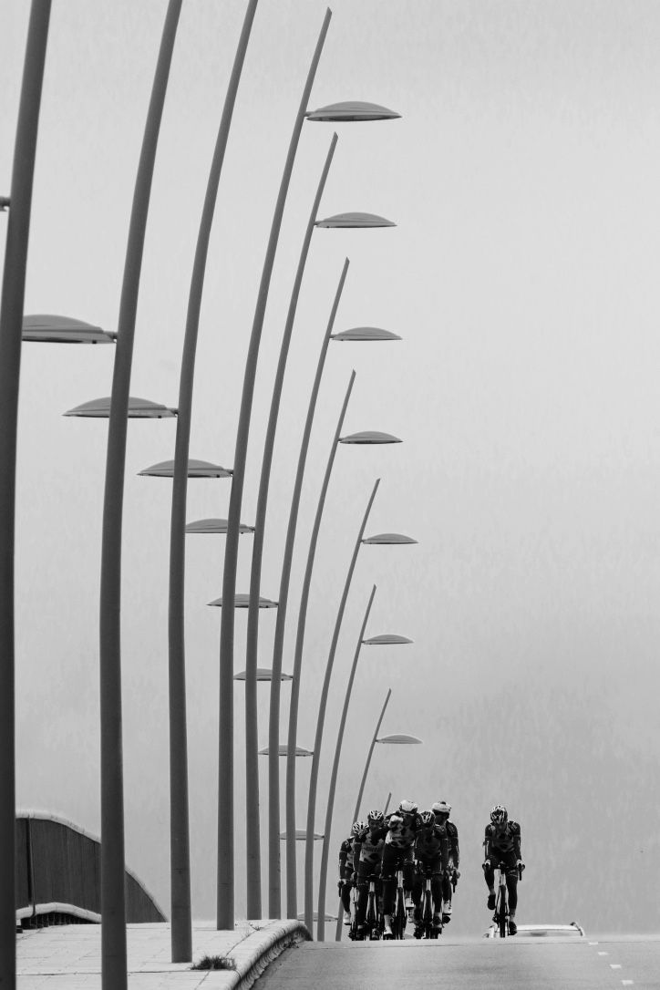 The team emerges over the crest of a small hill