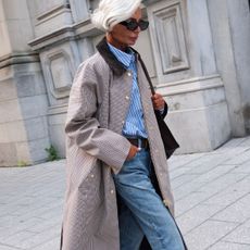 woman in stripe shirt and coat