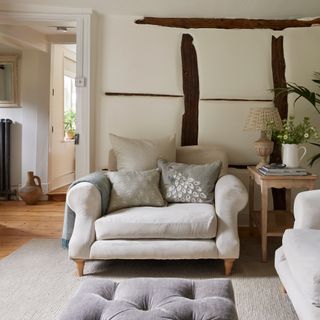 large neutral armchair in a modern country cottage living room