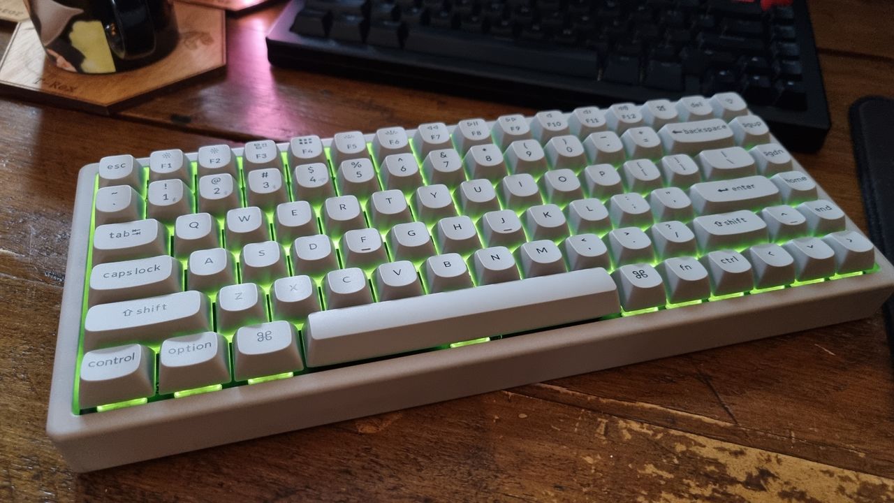 A Keychron K2 HE Concrete Edition keyboard on a wooden desk