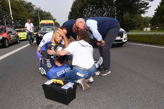 Etixx-QuickStep doctor Yvan Vanmol and Eneco Tour race doctors assess Tom Boonen after his crash.