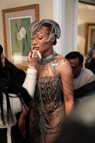 Megan Thee Stallion gets ready for the Gaurav Gupta haute couture show in Paris wearing a chainmail bodysuit and headpiece