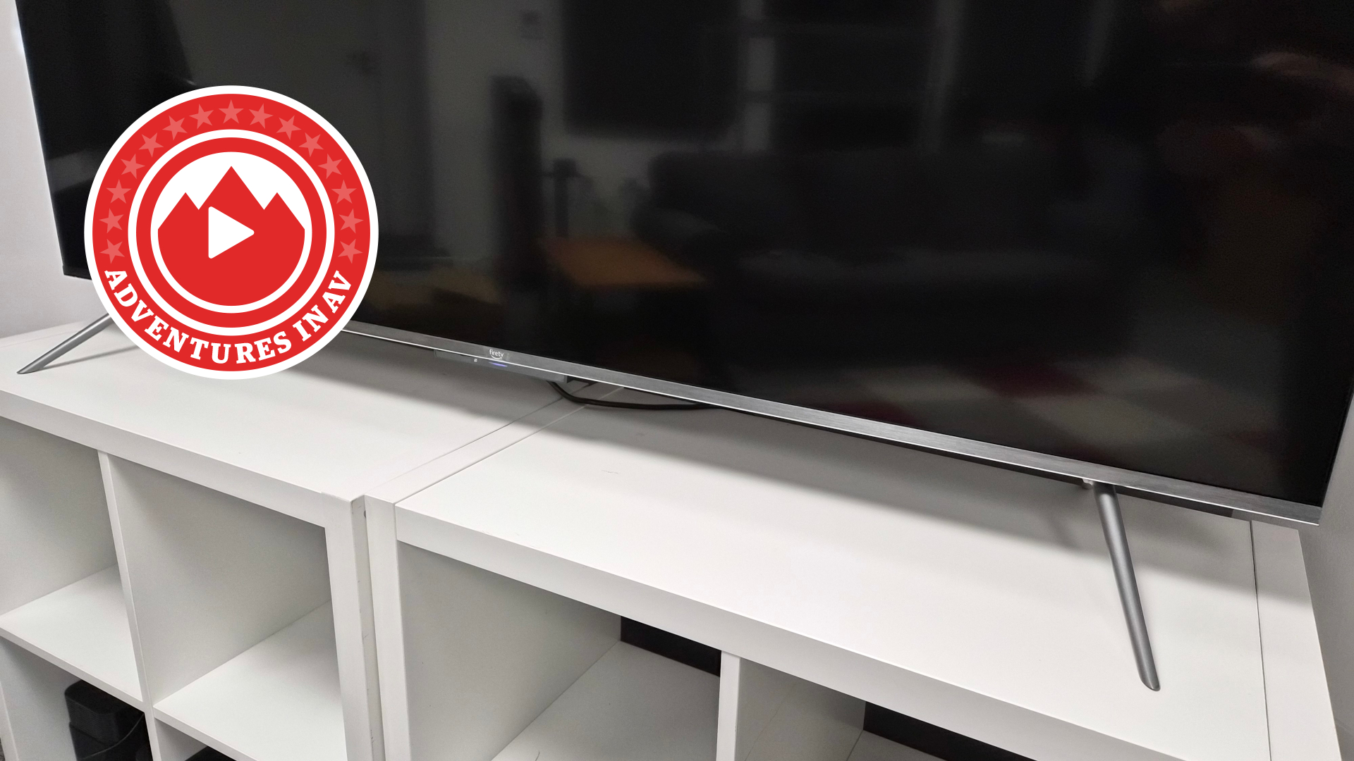 Amazon Fire TV feet on stand with Adventures in AV logo