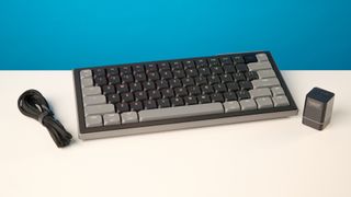 A black Cherry XTRFY K63W Pro Compact mechanical gaming keyboard