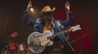Orville Peck performs onstage with his new signature Gretsch Falcon