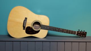 Martin D-28 against a blue wall in our photo studio