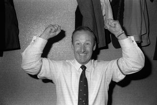 Arsenal manager Bertie Mee raises his arms in celebration after his side clinched the 1970/71 First Division title, securing qualification for the 1971/72 European Cup