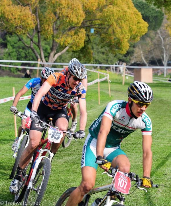A group of riders traverses the infield